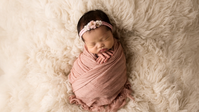Cradling Moments: Capturing the Innocence of Newborn Photography